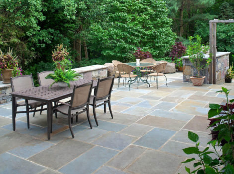 Large bluestone patio with 2 dining tables