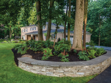 circular stack stone planters with new plantings