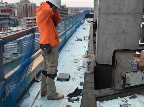 Man or rooftop under construction